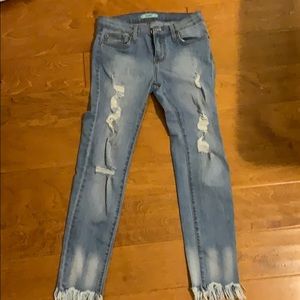 Karlie blue jeans with holes and fray